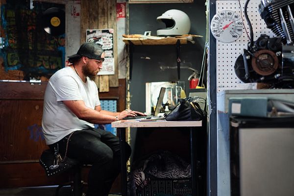 Business owner on his laptop looking at his options for a business line of credit