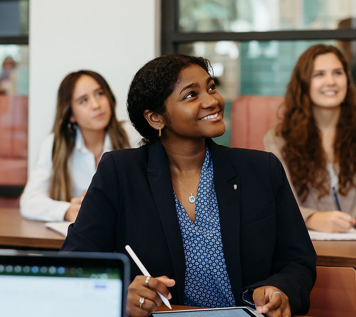 Female students collaborating in a study environment