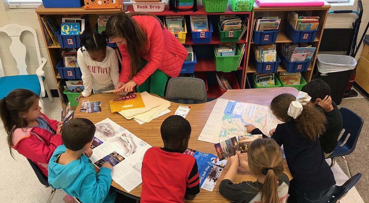 Students working on a writing project in Benton's first grade classroom